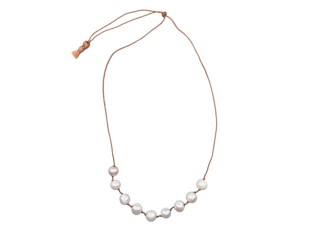 Nine White Pearls Strand on Brown Adjustable Cord
